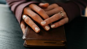Woman's hands on Bible